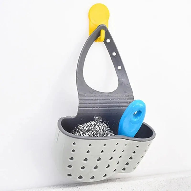 Hanging drain basket and adjustable soap and sponge holder